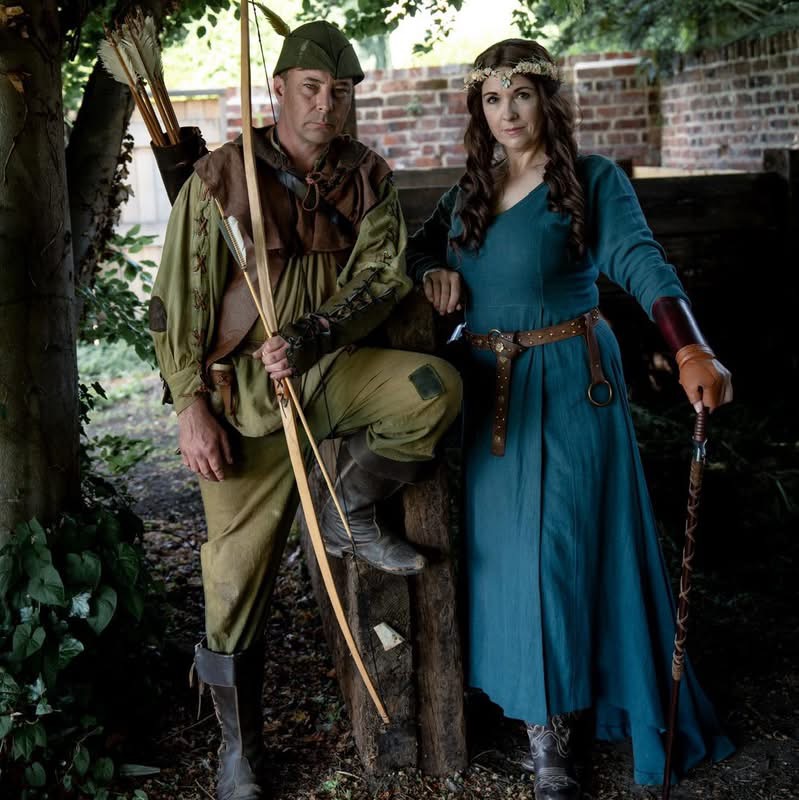 Robin Hood and Maid Marian in medieval costume at a Sherwood Outlaws display